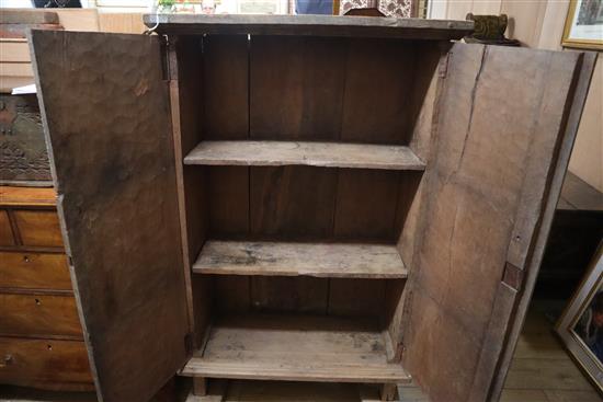 A Javanese solid teak cupboard W.95cm